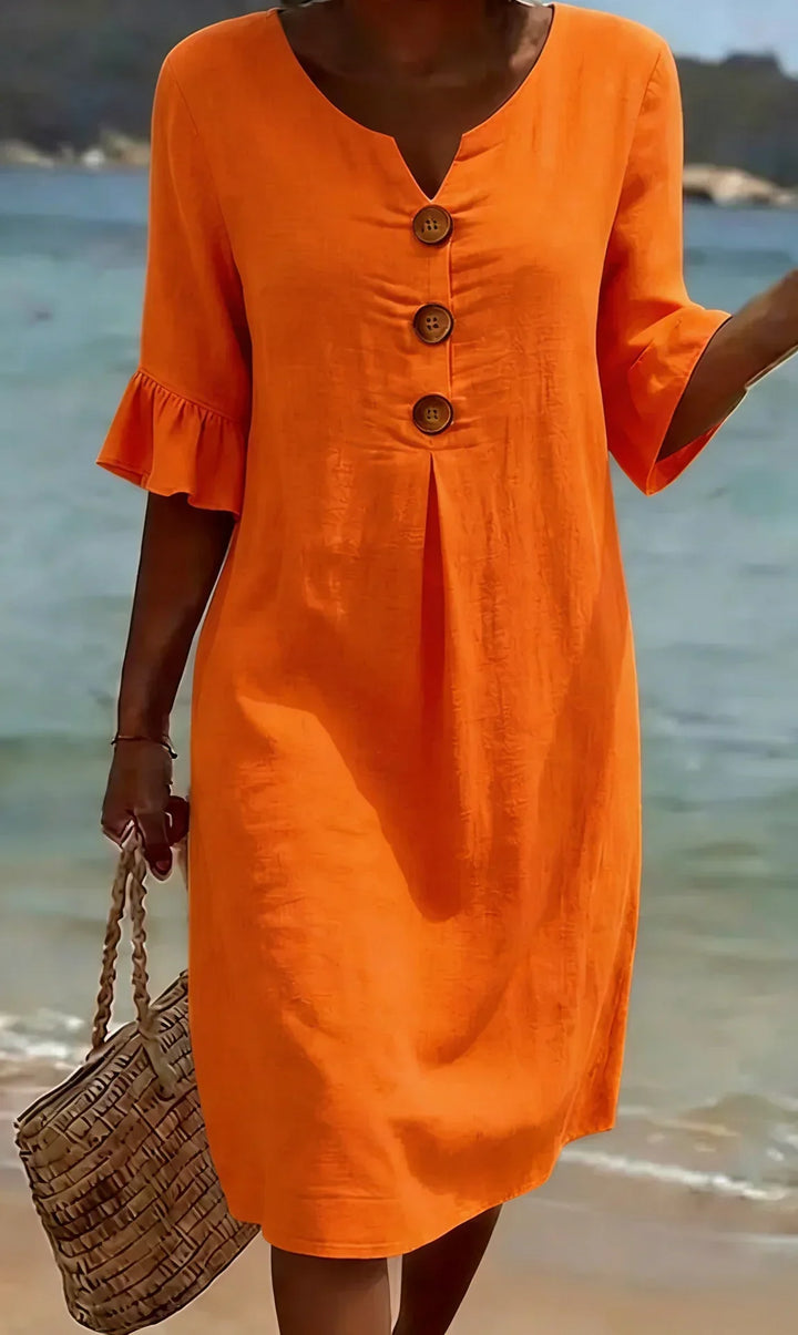 Vanesa | Textured dress with puff sleeves and buttons