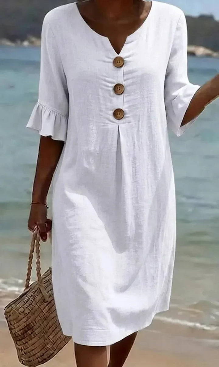 Vanesa | Textured dress with puff sleeves and buttons