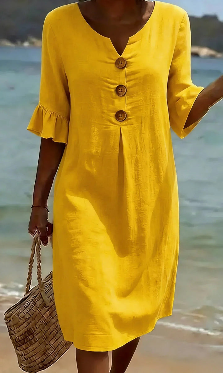 Vanesa | Textured dress with puff sleeves and buttons