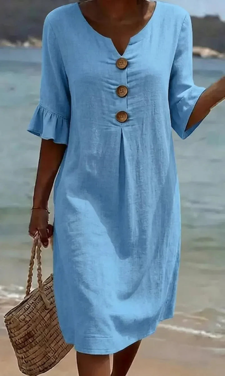 Vanesa | Textured dress with puff sleeves and buttons