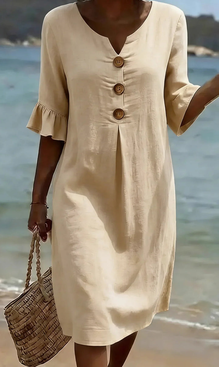 Vanesa | Textured dress with puff sleeves and buttons