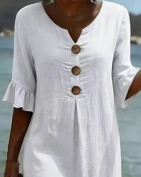 Vanesa | Textured dress with puff sleeves and buttons