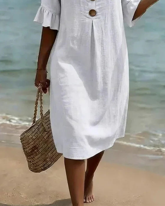 Vanesa | Textured dress with puff sleeves and buttons